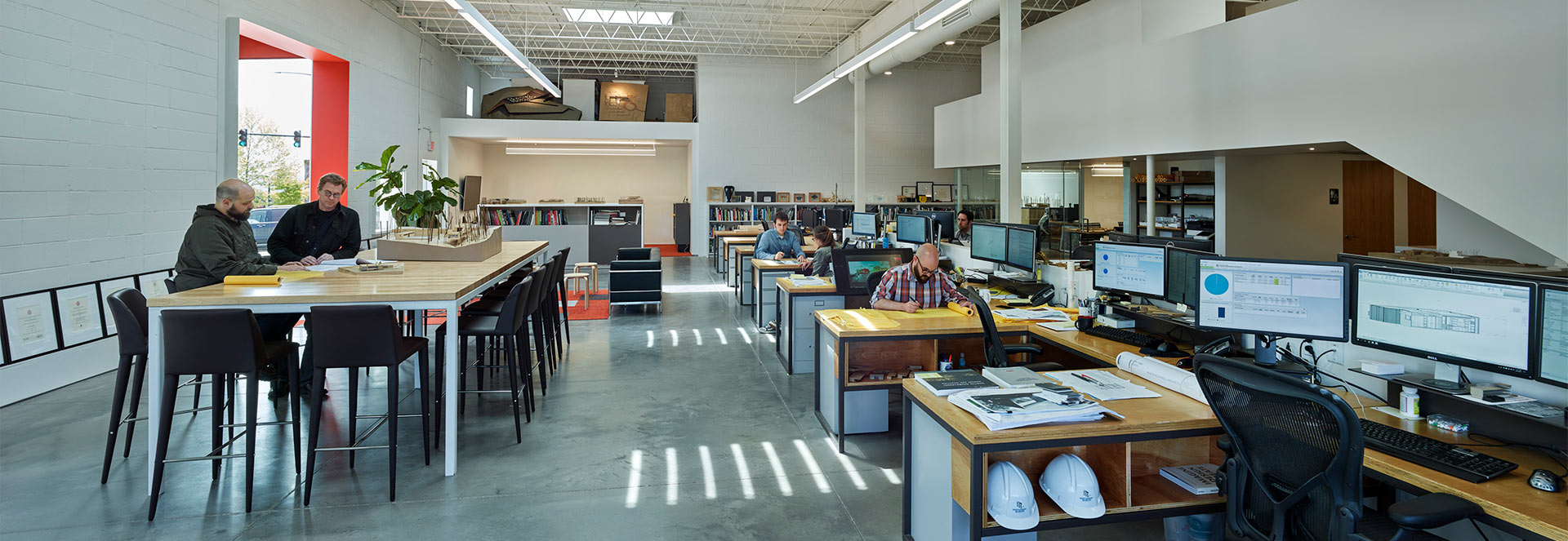 Side view photograph of Marlon Blackwell Architects working in the studio