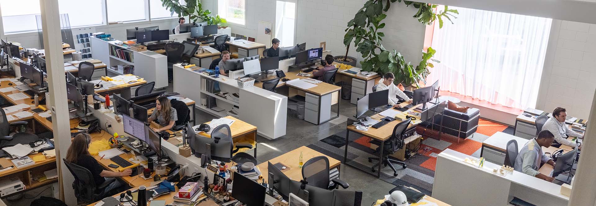 Photograph of Marlon Blackwell Architects working in the studio, shot from above