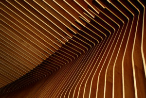Crystal Bridges Museum Store wall and ceiling made of parallel cherry plywood ribs in a wave-like formation