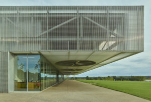 Giant metal fans overhanging the 'porch' that faces the lake