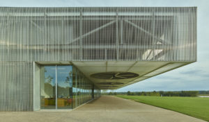 Giant metal fans overhanging the 'porch' that faces the lake