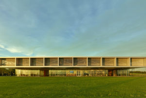 Profile of the visitor center seen in daylight with a bright blue sky