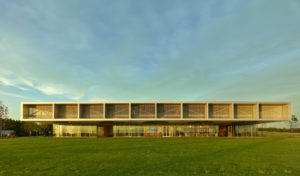 Profile of the visitor center seen in daylight with a bright blue sky