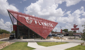 Front-on view of the triangular red metal screen on the Flyrite restaurant