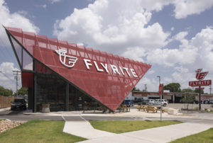 Front-on view of the triangular red metal screen on the Flyrite restaurant