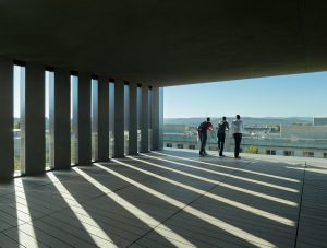 The top floor concrete and glass balcony looks down on the University campus and the city of Fayetteville beyond