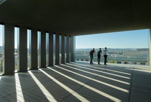 The top floor concrete and glass balcony looks down on the University campus and the city of Fayetteville beyond