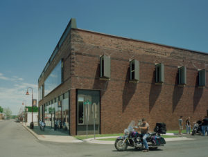 Gentry Public Library brick and glass exterior with glass window enclosures