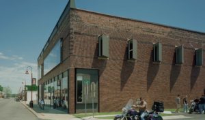 Gentry Public Library brick and glass exterior with glass window enclosures