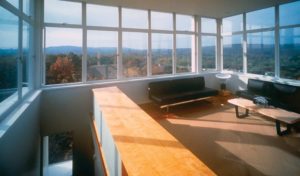 The modern interior of the Keenan TowerHouse shows a view of the sprawling woods