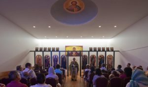 A church service under the dome of the St. Nicholas Eastern Orthodox Church