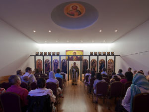 A church service under the dome of the St. Nicholas Eastern Orthodox Church