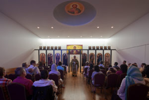 A church service under the dome of the St. Nicholas Eastern Orthodox Church