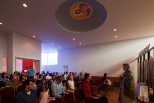 A church service under the dome of the St. Nicholas Eastern Orthodox Church