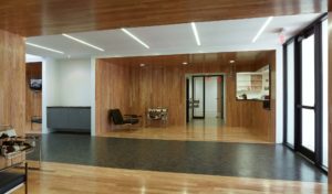 Wood walls and ceiling with modern furniture great visitors in the building's lobby