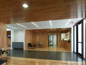 Wood walls and ceiling with modern furniture great visitors in the building's lobby