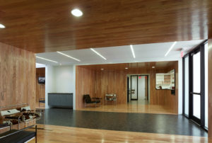 Wood walls and ceiling with modern furniture great visitors in the building's lobby