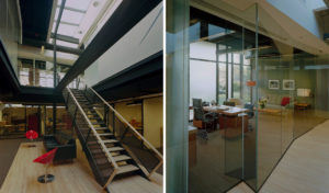 Beautiful wood, glass, and steel beams make up the interior which is lit by skylight above