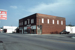 A Gentry Public Library historic photo of an old brick rectangular building