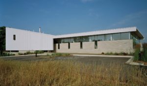 A view of the building's 'slipped enty' for people to enter from the parking lot