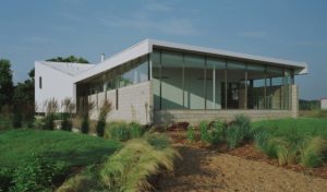 The Srygley Office Building exterior view of concrete block walls and a white metal wall and roof
