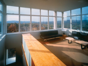 The modern interior of the Keenan TowerHouse shows a view of the sprawling woods
