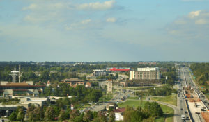 A view of the cayenne color face of the building from an aerial view in downtown rogers