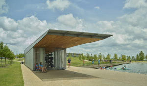 The Boathouse doors open as families to grab kayaks and dip into the water on a summer day