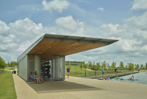 The Boathouse doors open as families to grab kayaks and dip into the water on a summer day