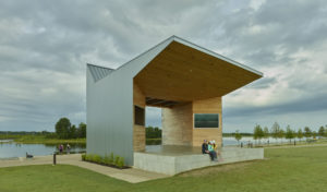 Shelby Farms Park structure opens to the lake beyond