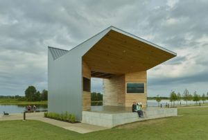 Shelby Farms Park structure opens to the lake beyond