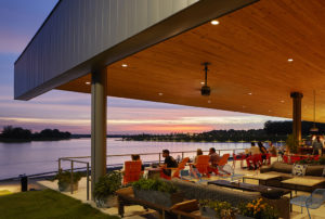 Exterior seating area by the water at night