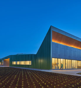 Thaden Reels exterior photo of it's angular modern structure at night