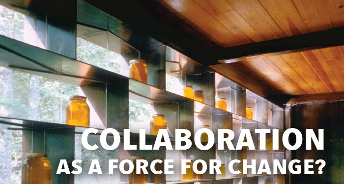 Collaboration as a Force for Change video thumbnail featuring an interior photo of a room with a wooden ceiling and honey jars in glass shelves facing out into the woods