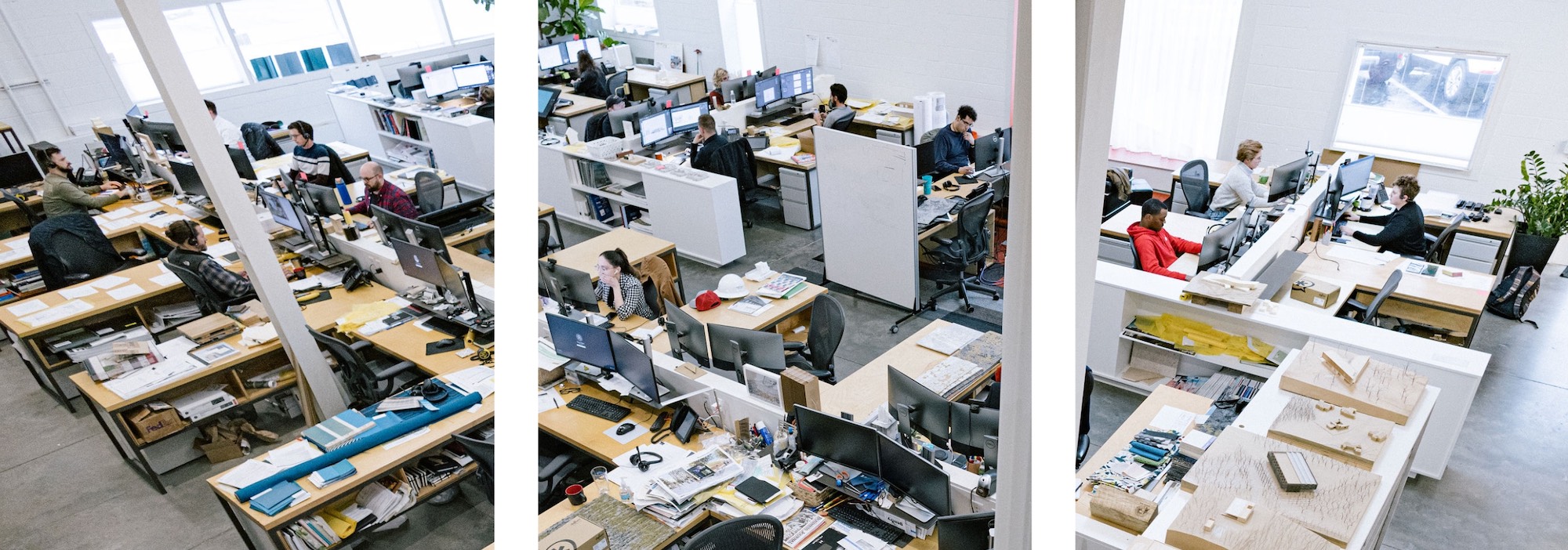 Photograph shot from above down on architects working in the studio