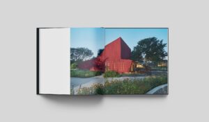Radical Practice book interior spread of a red building surrounded by beautiful landscaping